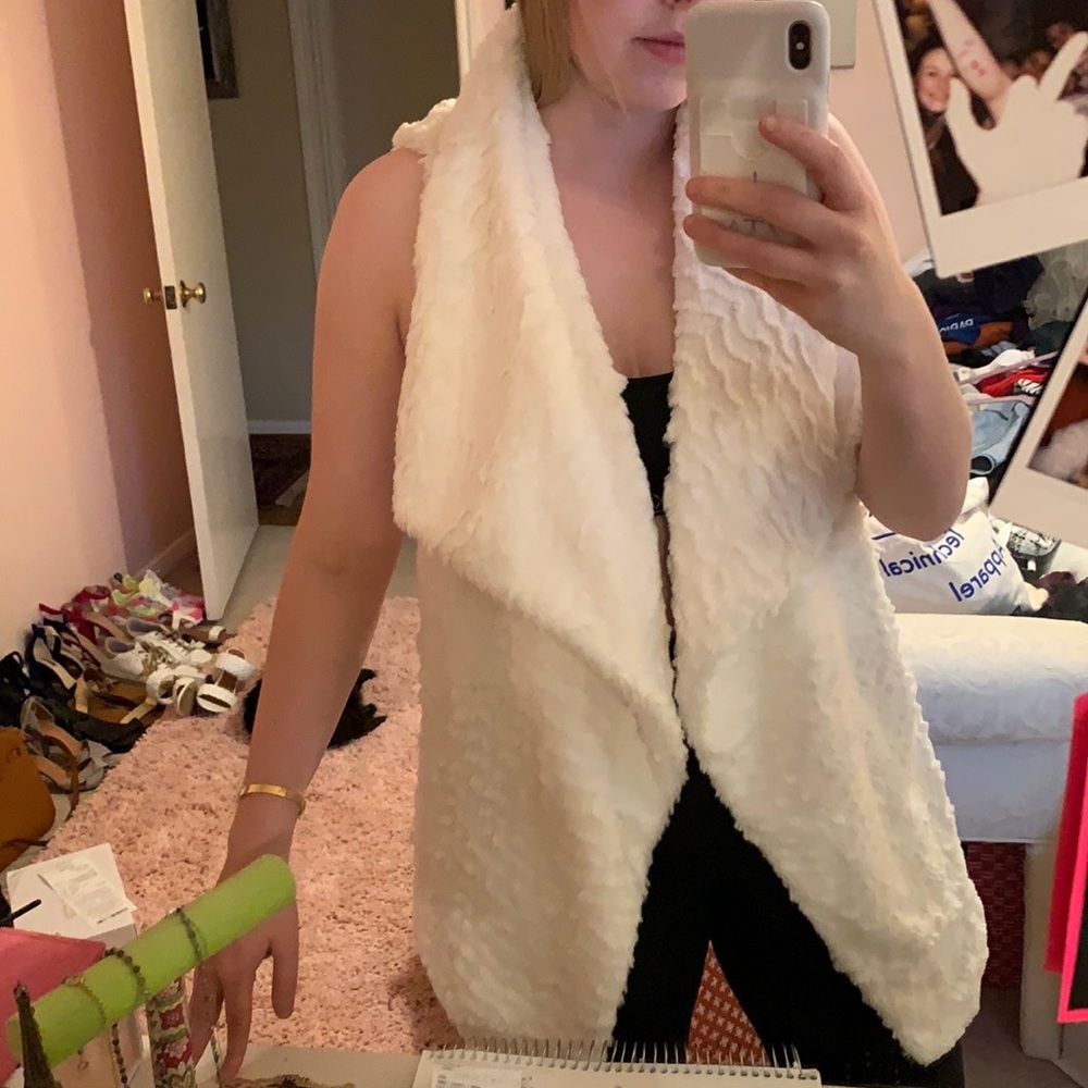 White fur vest
